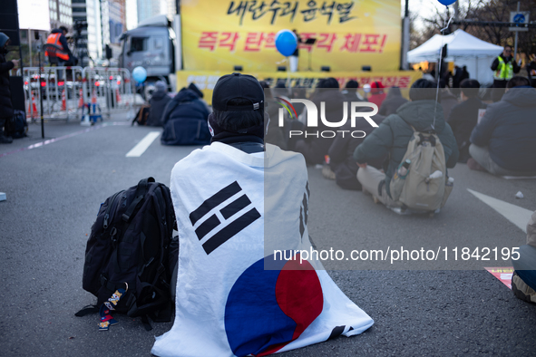 Citizens gather in Yeouido, South Korea, on December 7, 2024, to demand the impeachment and resignation of President Yoon Suk Yeol. Yoon's a...