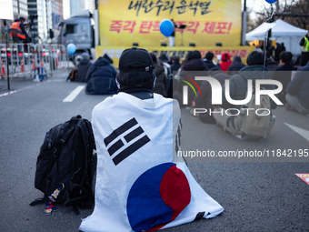 Citizens gather in Yeouido, South Korea, on December 7, 2024, to demand the impeachment and resignation of President Yoon Suk Yeol. Yoon's a...