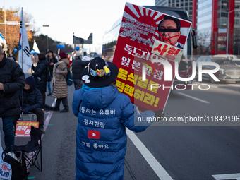 Citizens gather in Yeouido, South Korea, on December 7, 2024, to demand the impeachment and resignation of President Yoon Suk Yeol. Yoon's a...