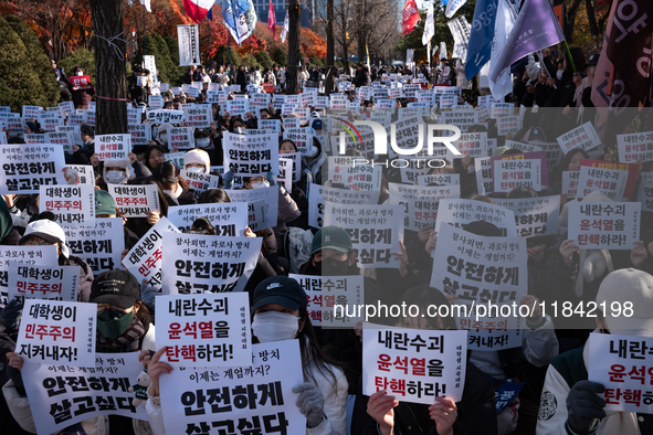 Hundreds of students from the National University Student Union gather in Yeouido, South Korea, on December 7, 2024, holding placards demand...