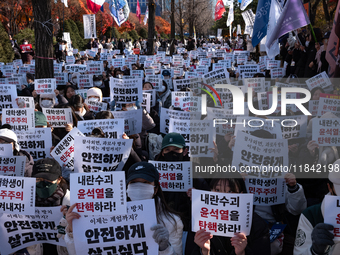 Hundreds of students from the National University Student Union gather in Yeouido, South Korea, on December 7, 2024, holding placards demand...