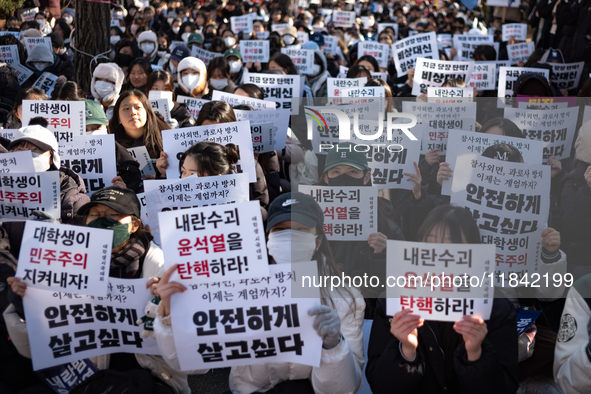 Hundreds of students from the National University Student Union gather in Yeouido, South Korea, on December 7, 2024, holding placards demand...