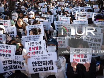 Hundreds of students from the National University Student Union gather in Yeouido, South Korea, on December 7, 2024, holding placards demand...