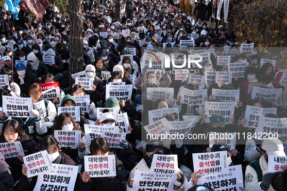 Hundreds of students from the National University Student Union gather in Yeouido, South Korea, on December 7, 2024, holding placards demand...