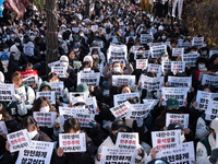 Hundreds of students from the National University Student Union gather in Yeouido, South Korea, on December 7, 2024, holding placards demand...