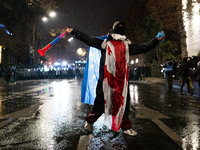 Anti-government protesters face police during a ninth consecutive day of mass demonstrations against the government's postponement of Europe...