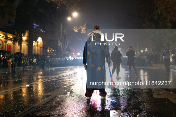 Anti-government protesters face police during a ninth consecutive day of mass demonstrations against the government's postponement of Europe...