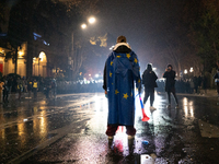 Anti-government protesters face police during a ninth consecutive day of mass demonstrations against the government's postponement of Europe...