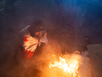 Anti-government protesters rally outside the parliament building during a ninth consecutive day of mass demonstrations against the governmen...