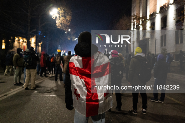 Anti-government protesters rally outside the parliament building during a ninth consecutive day of mass demonstrations against the governmen...