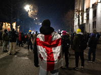 Anti-government protesters rally outside the parliament building during a ninth consecutive day of mass demonstrations against the governmen...