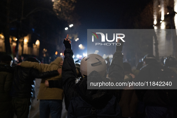 Anti-government protesters face police during a ninth consecutive day of mass demonstrations against the government's postponement of Europe...