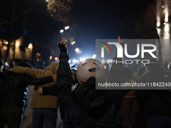 Anti-government protesters face police during a ninth consecutive day of mass demonstrations against the government's postponement of Europe...