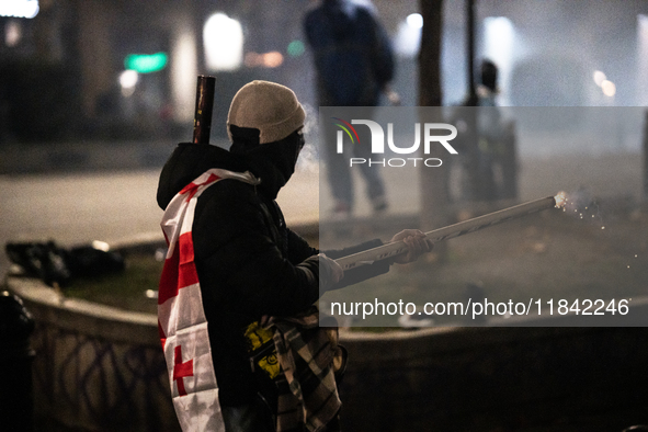 Anti-government protesters launch fireworks towards police during a ninth consecutive day of mass demonstrations against the government's po...