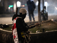 Anti-government protesters launch fireworks towards police during a ninth consecutive day of mass demonstrations against the government's po...