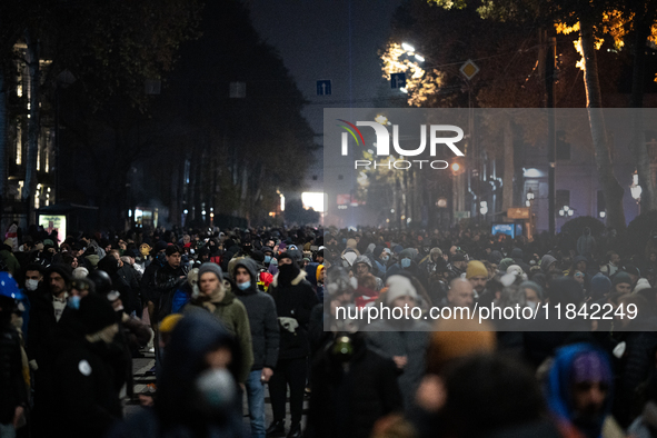 Anti-government protesters rally outside the parliament building during a ninth consecutive day of mass demonstrations against the governmen...