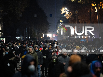 Anti-government protesters rally outside the parliament building during a ninth consecutive day of mass demonstrations against the governmen...