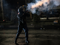 Police disperse anti-government protesters with tear gas during a ninth consecutive day of mass demonstrations against the government's post...