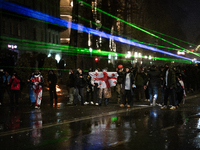 Anti-government protesters face police during a ninth consecutive day of mass demonstrations against the government's postponement of Europe...