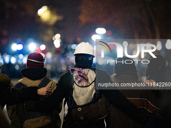 Anti-government protesters face police during a ninth consecutive day of mass demonstrations against the government's postponement of Europe...