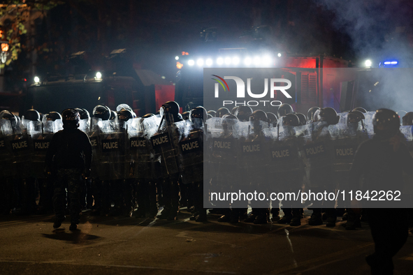 Police disperse anti-government protesters during a ninth consecutive day of mass demonstrations against the government's postponement of Eu...