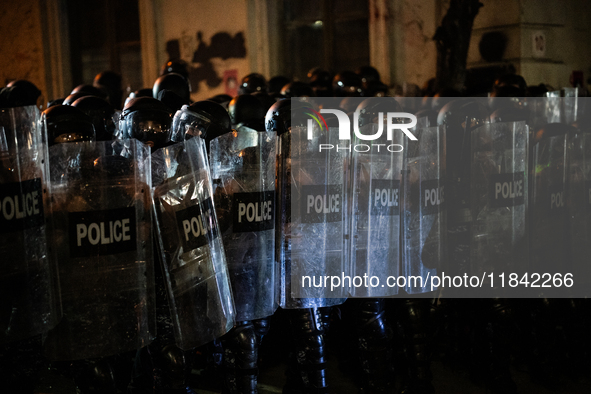 Police disperse anti-government protesters during a ninth consecutive day of mass demonstrations against the government's postponement of Eu...