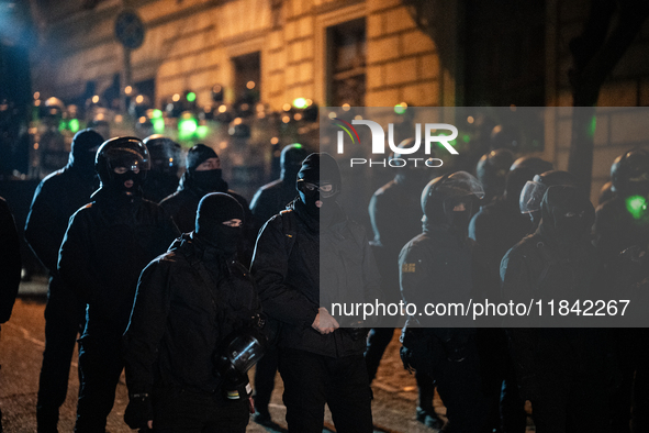 Police disperse anti-government protesters during a ninth consecutive day of mass demonstrations against the government's postponement of Eu...