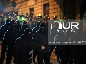 Police disperse anti-government protesters during a ninth consecutive day of mass demonstrations against the government's postponement of Eu...