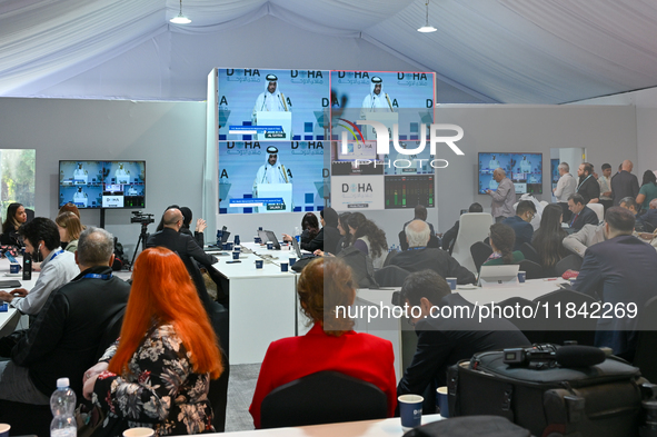 Media personnel inside the Media Centre watch a live telecast of Sheikh Mohammed bin Abdulrahman Al Thani, Prime Minister and Minister of Fo...