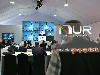 Media personnel inside the Media Centre watch a live telecast of Sheikh Mohammed bin Abdulrahman Al Thani, Prime Minister and Minister of Fo...