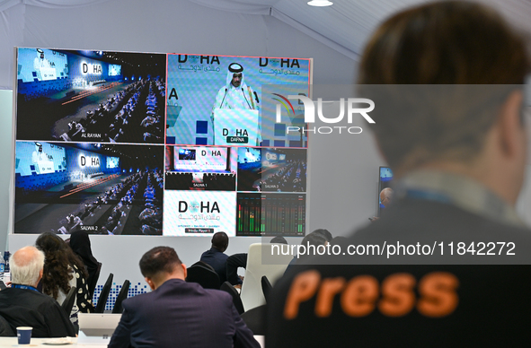 Media personnel inside the Media Centre watch a live telecast of Sheikh Mohammed bin Abdulrahman Al Thani, Prime Minister and Minister of Fo...