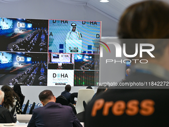 Media personnel inside the Media Centre watch a live telecast of Sheikh Mohammed bin Abdulrahman Al Thani, Prime Minister and Minister of Fo...