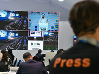 Media personnel inside the Media Centre watch a live telecast of Sheikh Mohammed bin Abdulrahman Al Thani, Prime Minister and Minister of Fo...