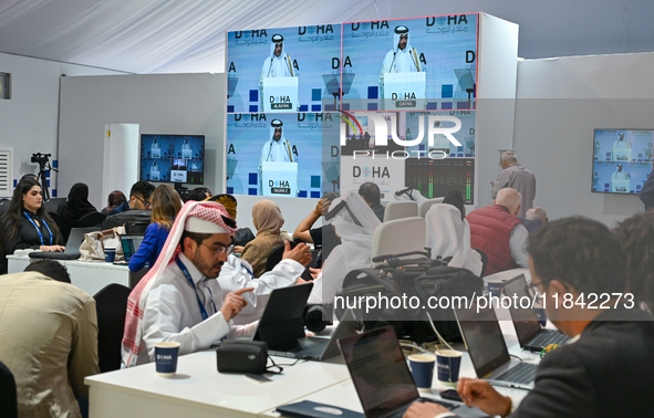 Media personnel inside the Media Centre watch a live telecast of Sheikh Mohammed bin Abdulrahman Al Thani, Prime Minister and Minister of Fo...