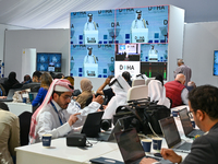 Media personnel inside the Media Centre watch a live telecast of Sheikh Mohammed bin Abdulrahman Al Thani, Prime Minister and Minister of Fo...