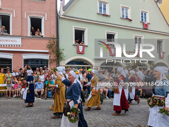 Over 2,000 participants recreate the medieval wedding of Hedwig Jagiellon and George of Bavaria. On July 16, 2023, in Landshut, Bavaria, Ger...