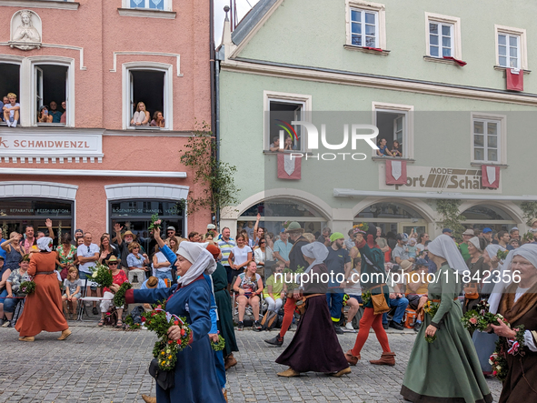 Over 2,000 participants recreate the medieval wedding of Hedwig Jagiellon and George of Bavaria. On July 16, 2023, in Landshut, Bavaria, Ger...