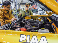 Visitors visit the booth of Ford Motor at the 2024 ASEAN International Auto Show in Nanning, China, on December 7, 2024. (