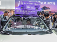 Visitors view Geely cars at the 2024 ASEAN International Auto Show in Nanning, China, on December 7, 2024. (