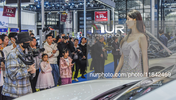 Visitors visit the Jetta booth at the 2024 ASEAN International Auto Show in Nanning, China, on December 7, 2024. 