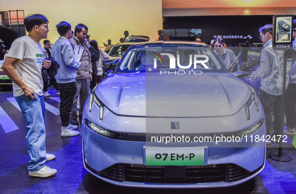 Visitors visit Lynk & Co 07EM-P at the 2024 ASEAN International Auto Show in Nanning, China, on December 7, 2024. 