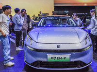 Visitors visit Lynk & Co 07EM-P at the 2024 ASEAN International Auto Show in Nanning, China, on December 7, 2024. (