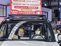 Visitors attend the 2024 ASEAN International Auto Show in Nanning, China, on December 7, 2024. (