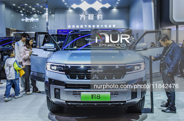 Visitors view a BYD Leopard 8 at the 2024 ASEAN International Auto Show in Nanning, China, on December 7, 2024. 