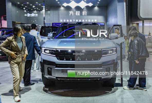 Visitors view a BYD Leopard 8 at the 2024 ASEAN International Auto Show in Nanning, China, on December 7, 2024. 