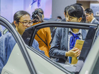 Visitors look at BYD's YANGWANG stand at the 2024 ASEAN International Auto Show in Nanning, China, on December 7, 2024. (