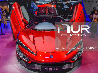 Visitors look at BYD's YANGWANG stand at the 2024 ASEAN International Auto Show in Nanning, China, on December 7, 2024. (