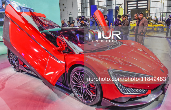 Visitors look at BYD's YANGWANG stand at the 2024 ASEAN International Auto Show in Nanning, China, on December 7, 2024. 