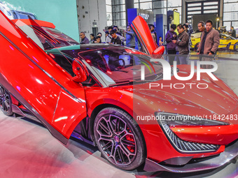 Visitors look at BYD's YANGWANG stand at the 2024 ASEAN International Auto Show in Nanning, China, on December 7, 2024. (