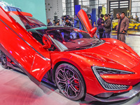 Visitors look at BYD's YANGWANG stand at the 2024 ASEAN International Auto Show in Nanning, China, on December 7, 2024. (